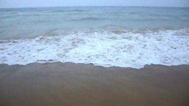 Sea waves water breaking on the beach of Puri beach in the bay of Bengal, Odisha, India. February 2020.