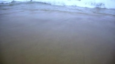 Sea waves water breaking on the beach of Puri beach in the bay of Bengal, Odisha, India. February 2020.
