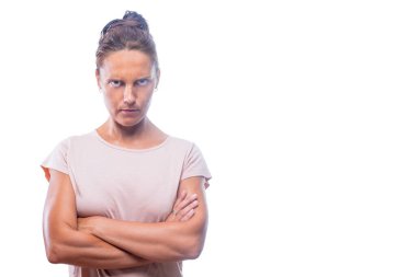 self-assured woman with her arms crossed looking at camera