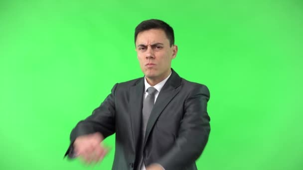 Displeased man showing stop gesture and turning head away — Stock Video