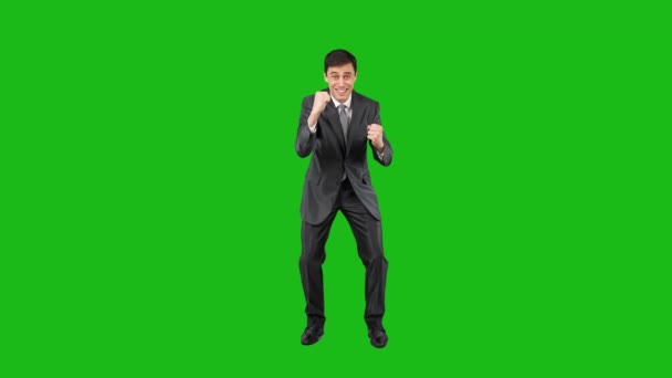 Excited man celebrating victory in studio. Chroma key — Stock video