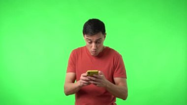 Excited man reading celebrating message on smartphone and shouting