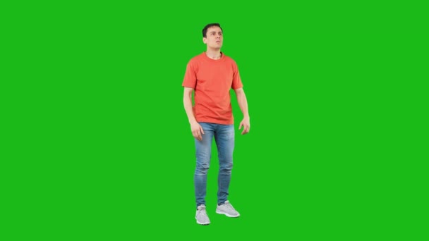 Worried male looking at distance. Green background — Stock Video