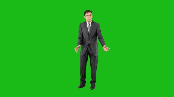 Hysterical businessman in suit in studio. Chroma key — Stockvideo