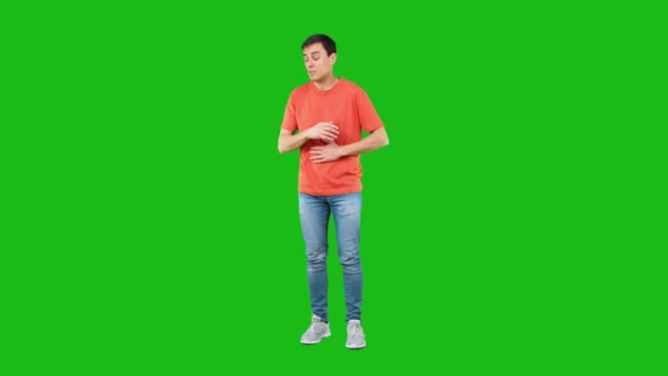 Sick man coughing with closed eyes. Green background — Stockvideo