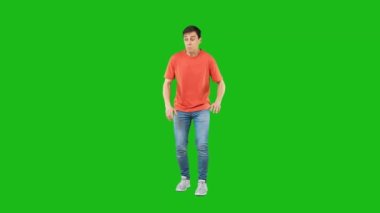 Expressive man showing silence gesture in studio