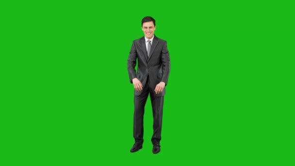 Cheerful male worker in suit smiling in chroma key — Stock Video
