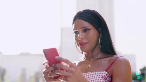 Transgender Woman Smiling While Using Mobile — Stockvideo