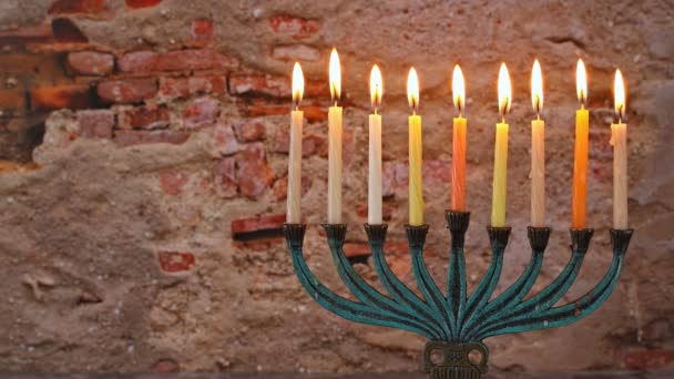 Hebrew Menorah of Hanukkah with burning candles is traditional symbol for holiday Jewish — Stock Video