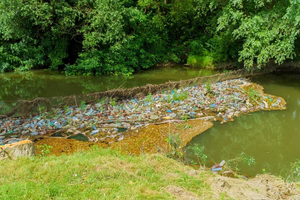 Beat plastic pollution with plastic bottles of cleaning plastic pollution of the river life