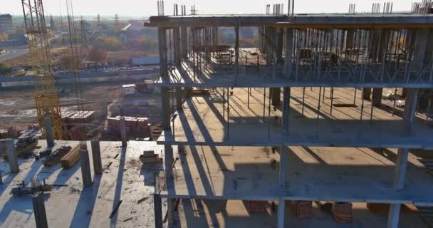 Construction of a multi-storey apartment building are work along the building in progress — Stock Video