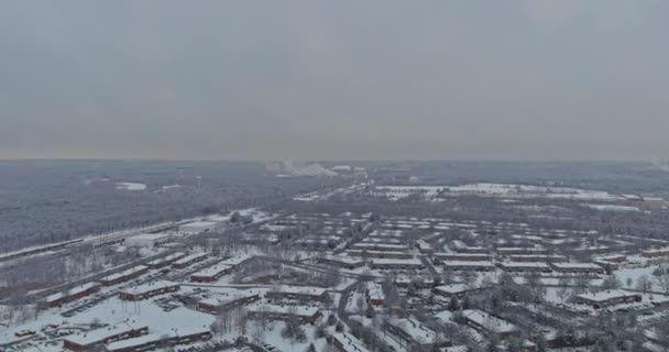 Aerial view in small town a freshly fallen snow with covered roof of a house after snowfall — Stock Video