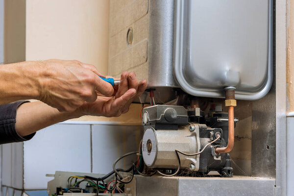 Residential heating equipment with tehnic fix the problem servicing on gas boiler for hot water and heating