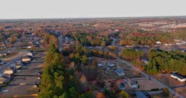 Aerial view of colorful autumn fall trees foliage with houses in countryside rural road small town in Boiling Spring South Carolina — 图库视频影像