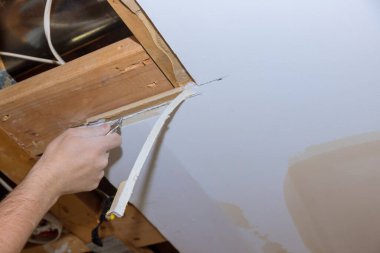 Renovation home improvement apartment interior damage for drywall board with repair home of man cutting plasterboard