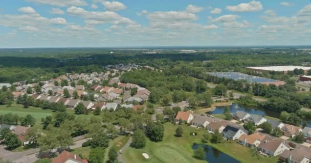 View top aerial in small american town Cranbury New Jersey of urban rooftops summer landscape — Stockvideo