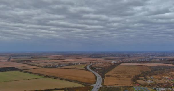 Aerial of landscape top view of the asphalt road in the middle of agricultural fields — Video Stock