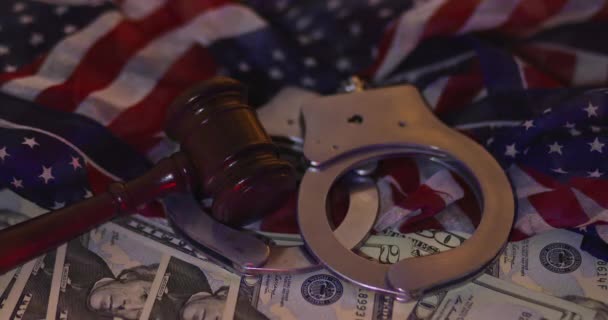 Financial coruption legal justice the wooden judgment gavel police handcuffs of cash US dollars with light flasher police — Stock Video