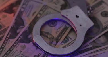 Criminal corruption handcuffs money of light flasher police