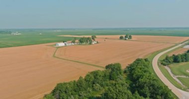 Grain elevator with large storage bins of corn, grain on aerial top view