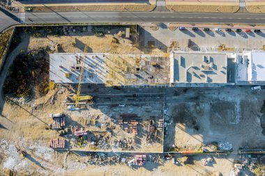 Aerial view under construction building a concrete multi-story modern residential apartment complex