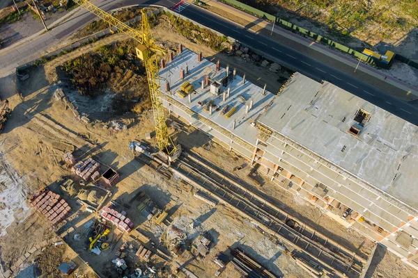 Tower crane on a construction site high-rise building under construction modern residential complex with aerial view