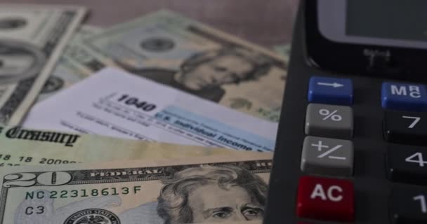 U.S. Individual Income Tax Return form 1040 and dollar bills Pay Tax — Stock video