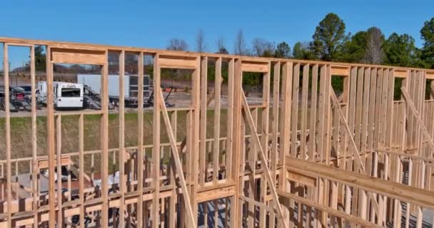 Fragment of a new home under construction wood framing beams — Stock Video