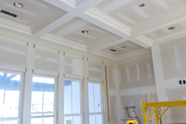 New house under construction with finishing plastering drywall in ready for paint