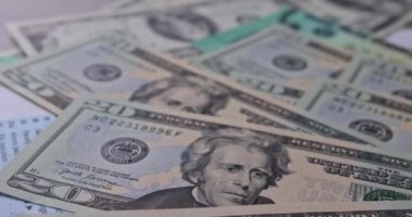 Stimulus relief check on US dollar cash banknote about Form 7200, Advance Payment of Employer Credits Due to COVID-19