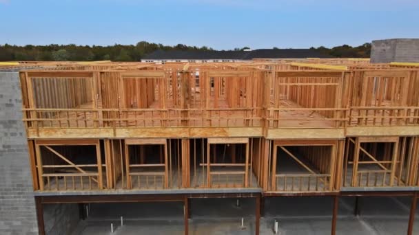Aerial view the a new house under construction wood framing beams — Αρχείο Βίντεο