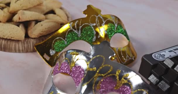 Carnival with noisemaker Hamantaschen cookies Purim jewish holiday — Stock Video