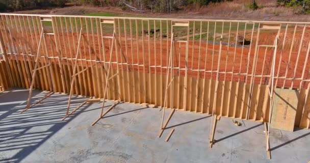 Wooden framework on stick built home residential under construction of beam framing — Stock Video