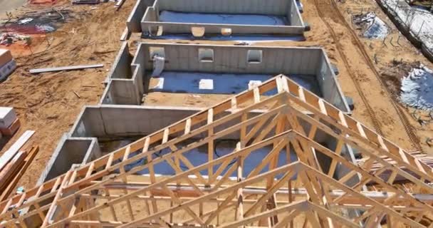 Aerial view the timber frame beam framework house stick built home under construction new build with wooden truss — Stock Video