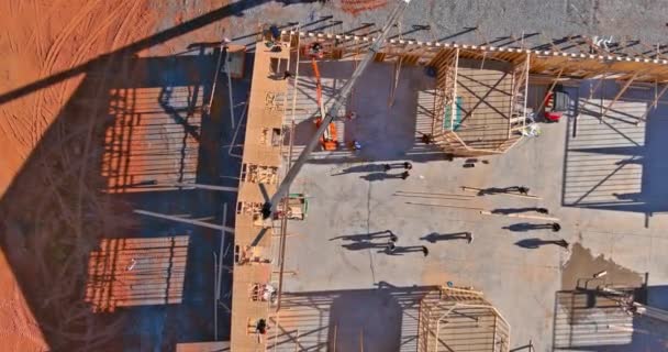 Roofer working with framing installing the roof truss system — Stock Video