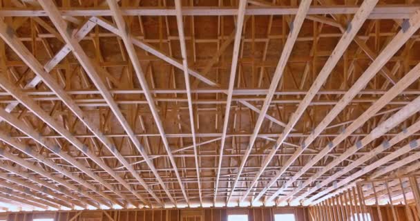 Builder roof trusses on roof of new house residential building under construction — Stock Video