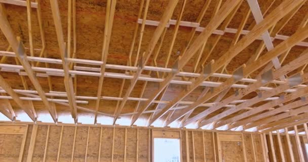 Wood framed building roof at a under construction site — Stock Video