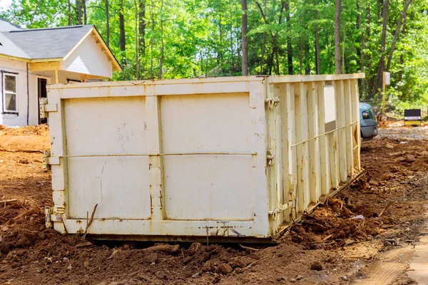 Industrial dumpster filled loaded rubbish removal container renovation building — Stockfoto