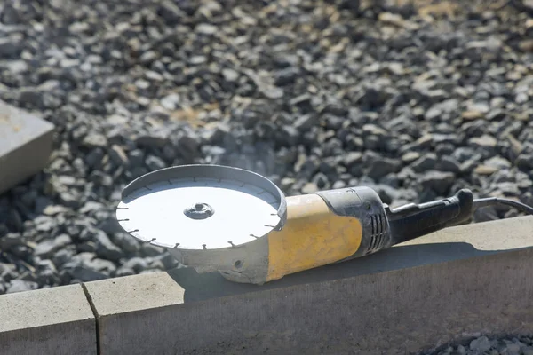 Concrete cutting with saw blade at construction site — Stockfoto