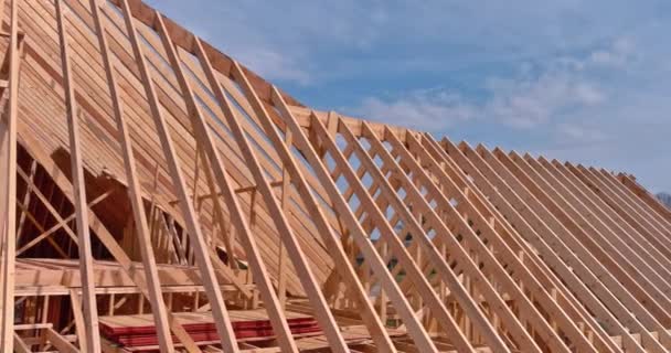 Aerial view of wood framework under construction on new wooden house — Stockvideo