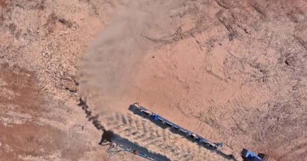 An industrial wood chipper at work with roots for grinding machine to become chip — 图库视频影像