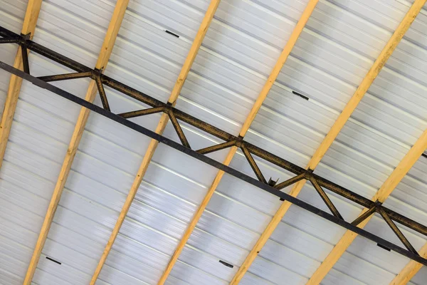 Construction site in metal roof of a warehouse center in storage building frame