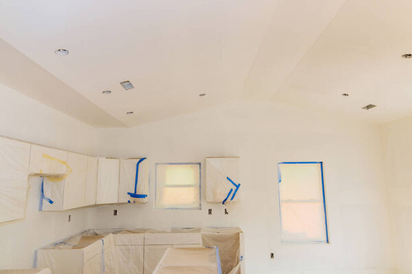 Progress painting kitchen indoor color white making repair in wall and celling interior paint