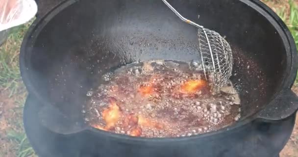 Chicken Wings Fried Cast Iron Cauldron Boiling Oil — Stock Video