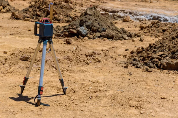 During a construction trench for a concrete foundation , the contractor uses rotary laser leveling equipment for measurement