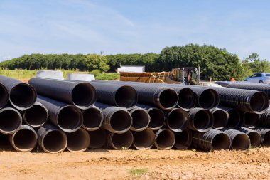 View new black plastic pipes for the drainage system on new home construction site
