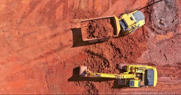 Construction Site Preparation Work Excavator Loading Earth Dump Trucks — Stockvideo