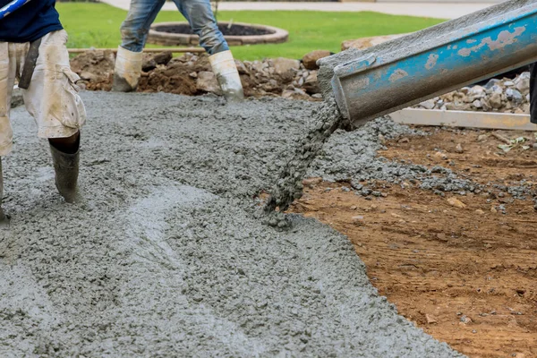 Paving Driveway Construction Site While Pouring Wet Concrete New Home — стоковое фото