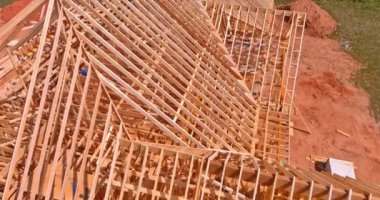 In an aerial view of a new building, there is timber truss frame beam framework