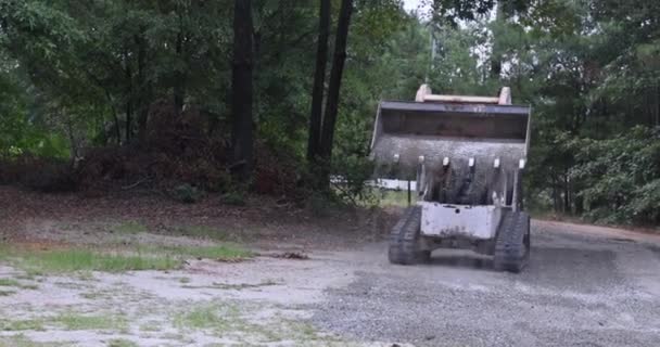 Old Road Reconstruction Project Requires Use Bobcat Tractor Move Unload — Video Stock
